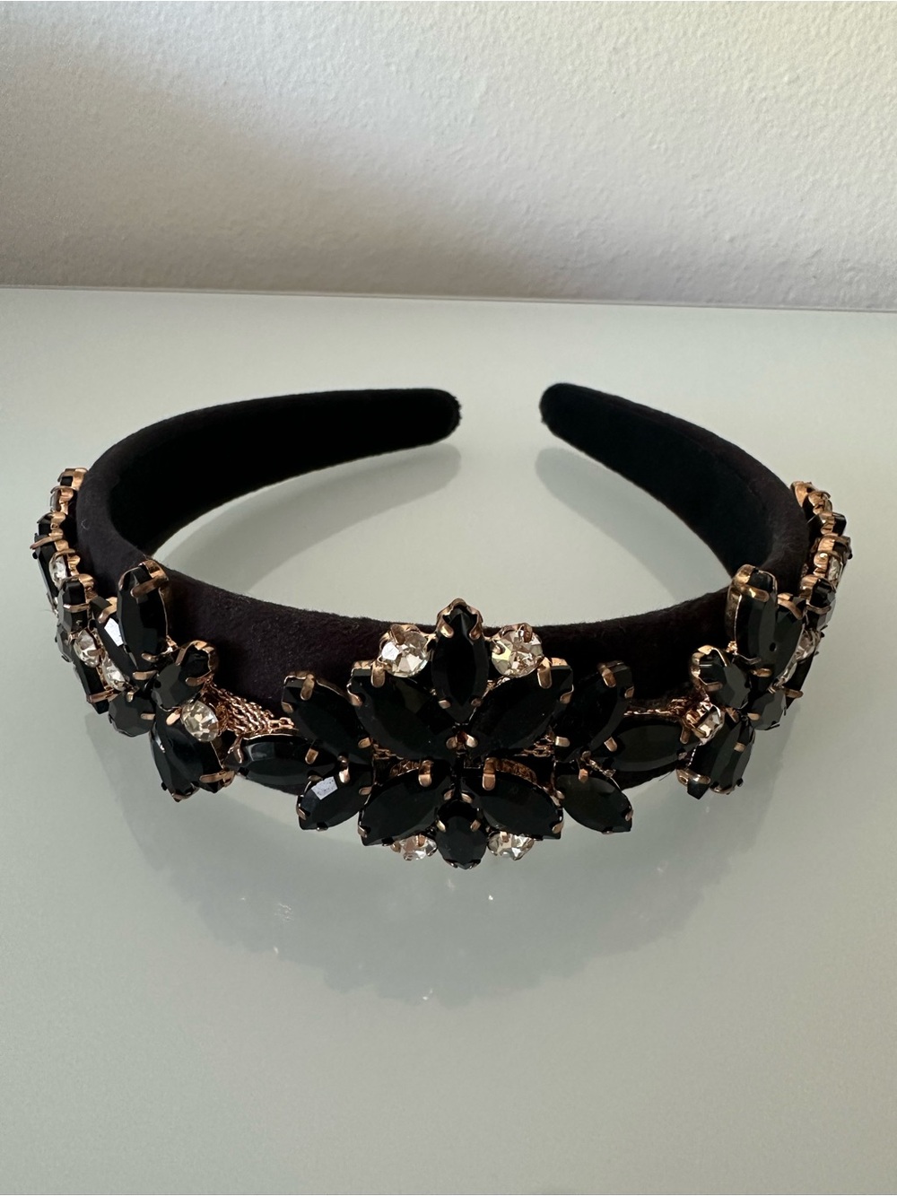 Black headband with black decorative stones , new without tags.